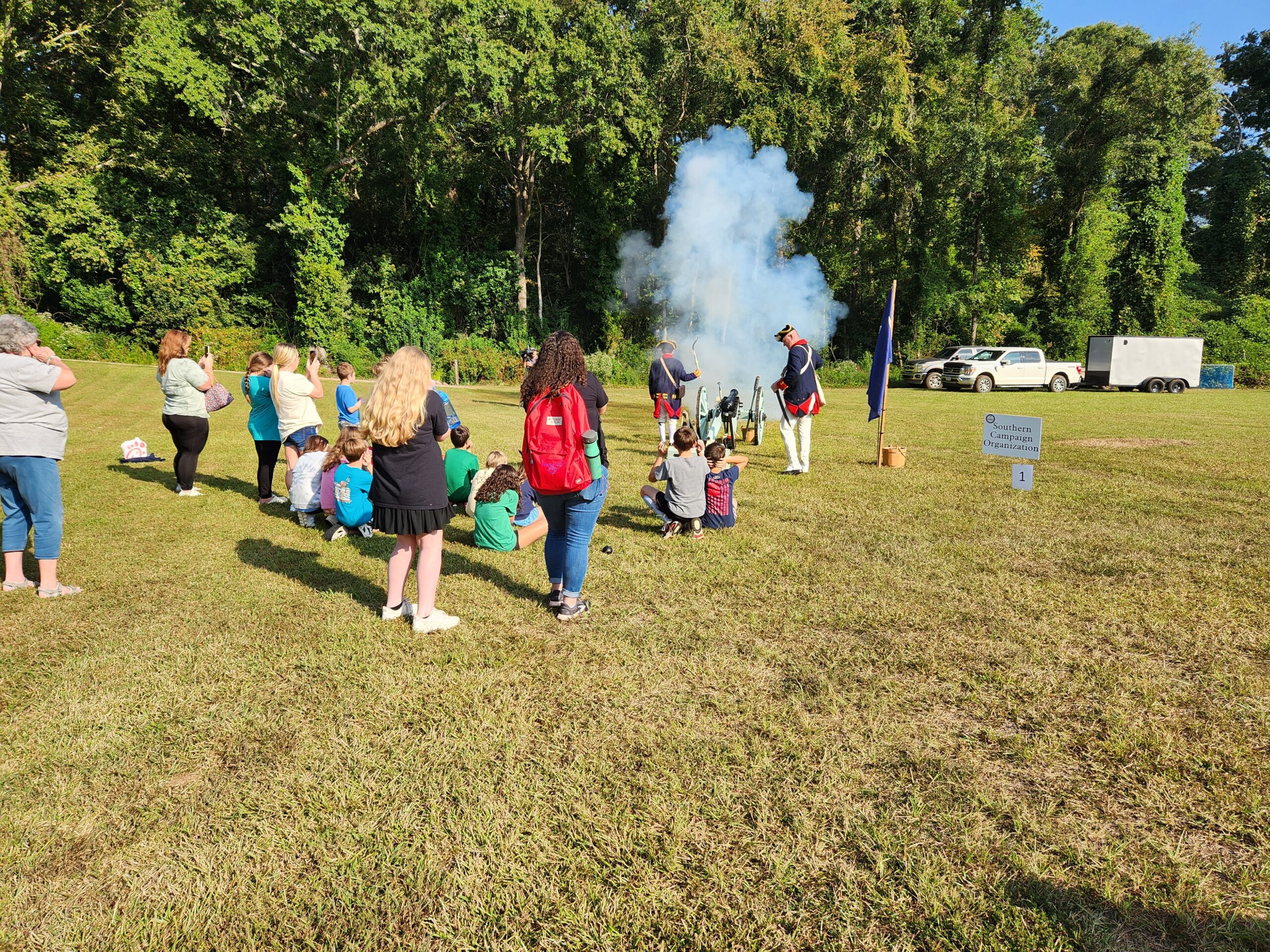 Students watching a historic cannon demonstration during Liberty Live Education Day